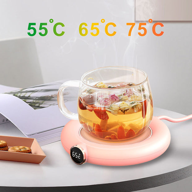 Cup warmer pad with adjustable temperature settings 55°C, 65°C, and 75°C, featuring a glass tea cup and LED display.