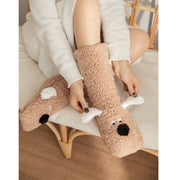 Cute plush cartoon dog floor socks for women, winter warm non-slip design, stylish and comfortable for cozy home wear.