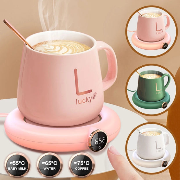 Adjustable cup warmer pad with LED display, featuring pink mug and three temperature options for beverages.