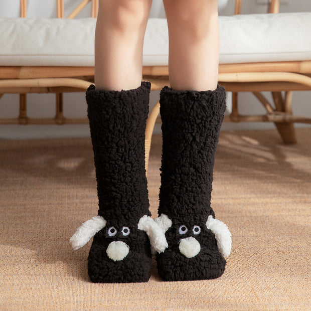 Cute cartoon dog plush floor socks for women, non-slip, cozy winter wear displayed on feet.